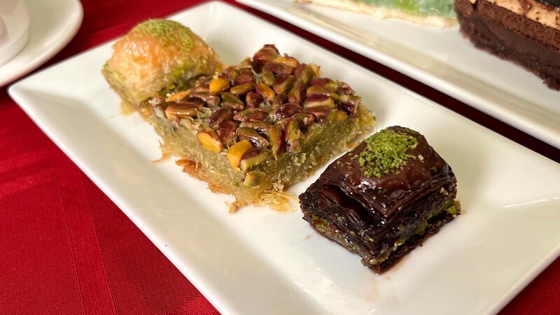 Three dessert pastries on a plate